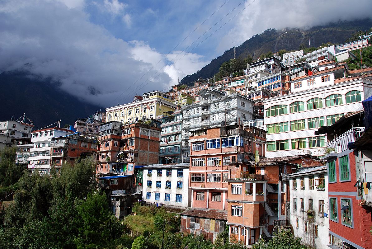 11 Zhangmu Tibet Zhangmu (Tib. Dram, Nep. Khasa, 2300m) is the Tibet border town just across from Kodari and is a major trading post between Tibet and Nepal. Zhangmu is built on a steep uphill street that twists through town in a series of tight switchbacks, lined with private homes, shops, restaurants and government buildings.